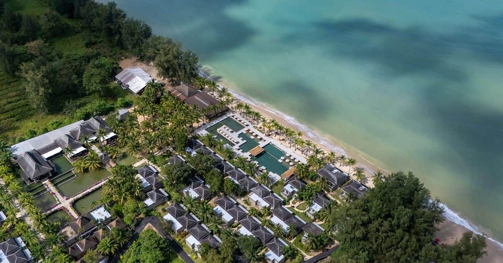 Aerial view of ananea Beyond Khaolak, a beachfront Khao Lak resort featuring private villas, tropical gardens, a swimming pool, and the turquoise waters of the Andaman Sea.