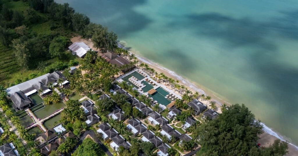 Aerial view of luxury Khao Lak resort ananea Beyond Khaolak, featuring beachfront villas, swimming pools and lush tropical surroundings along the Andaman Sea.
